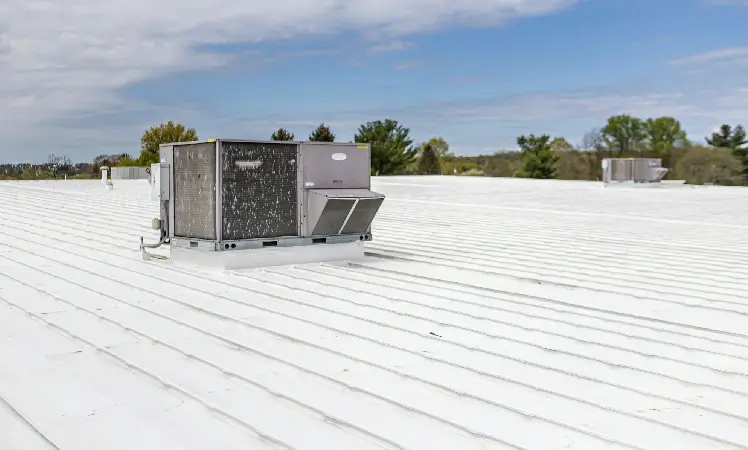 Commercial metal roofing with roof coating