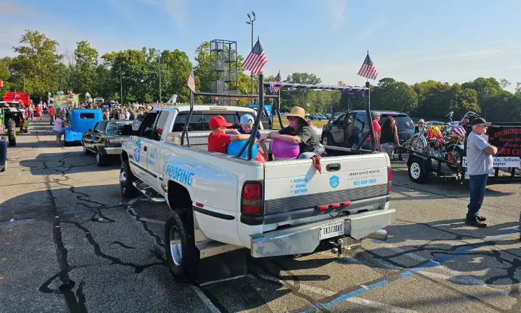 Urban Shield Roofing truck in parade