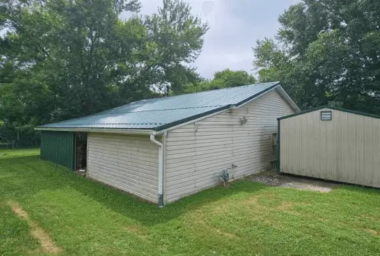 small building, metal shingles