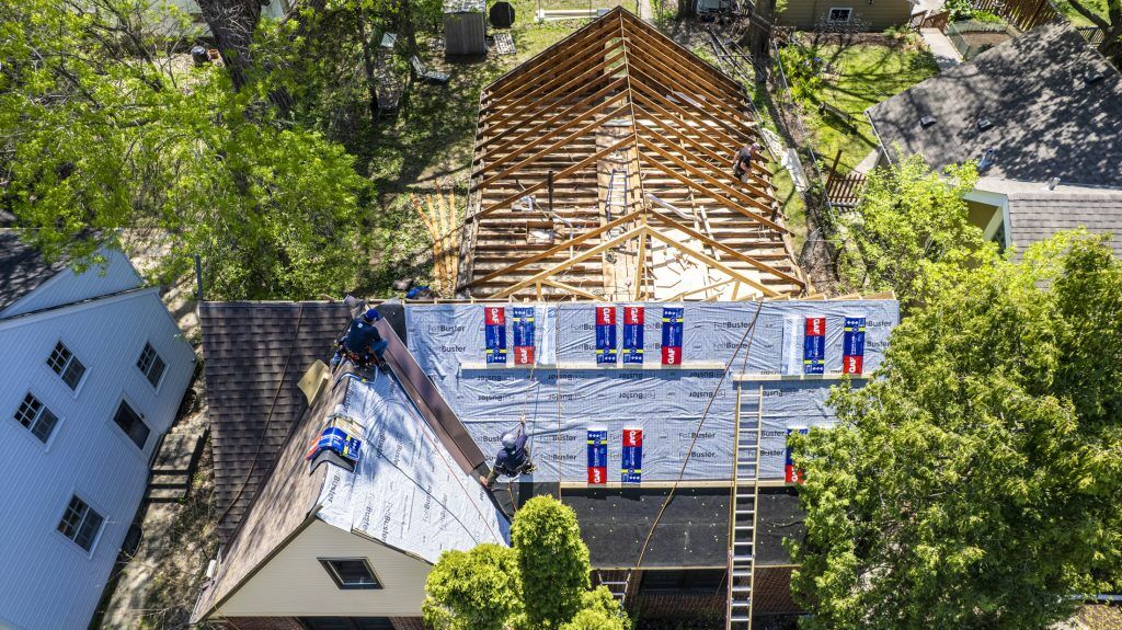 A roof replacement in progress in reference to the question "How Long Does It Take to Replace a Roof?"